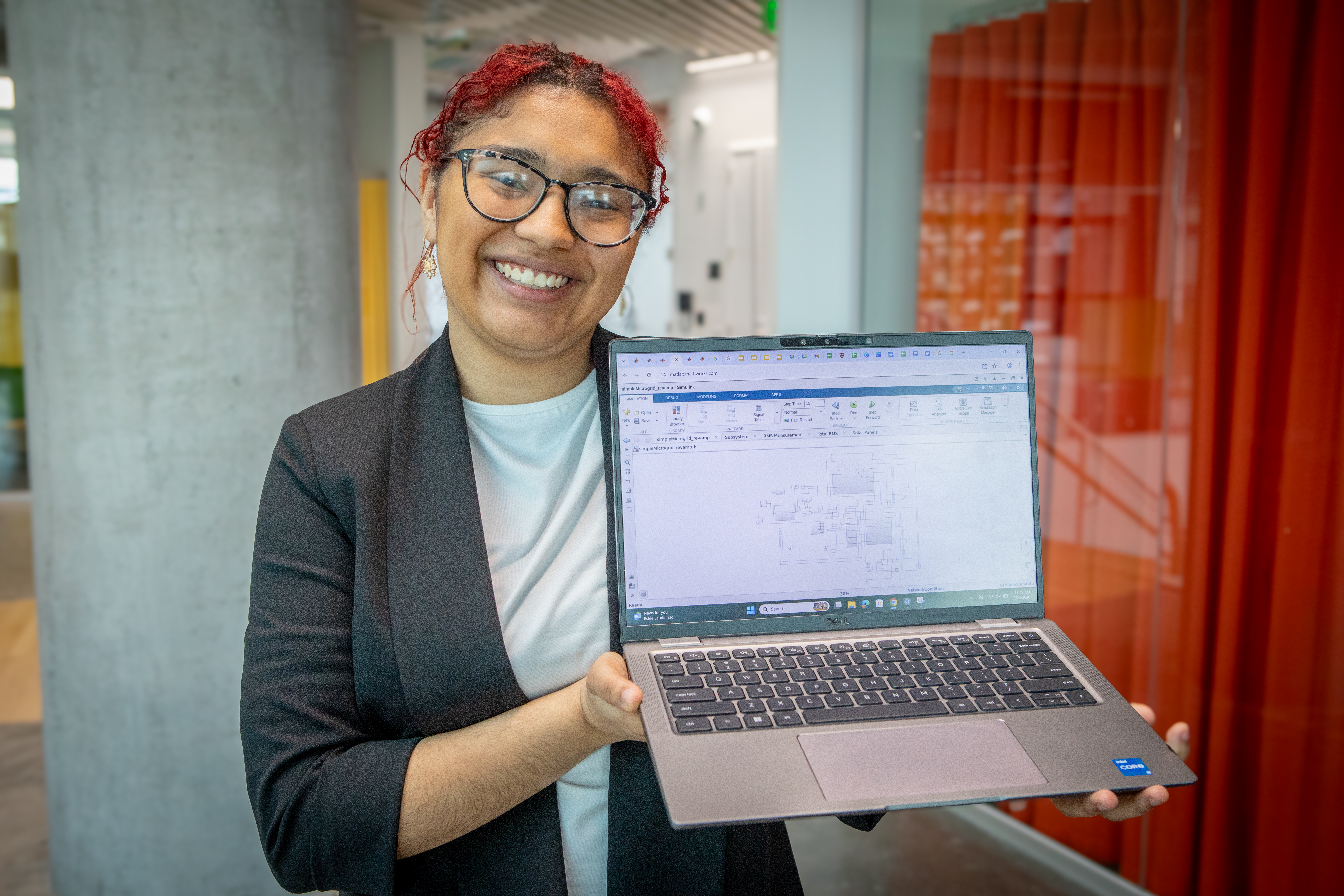 Harvard SEAS student Ellen Caraballo holding a laptop