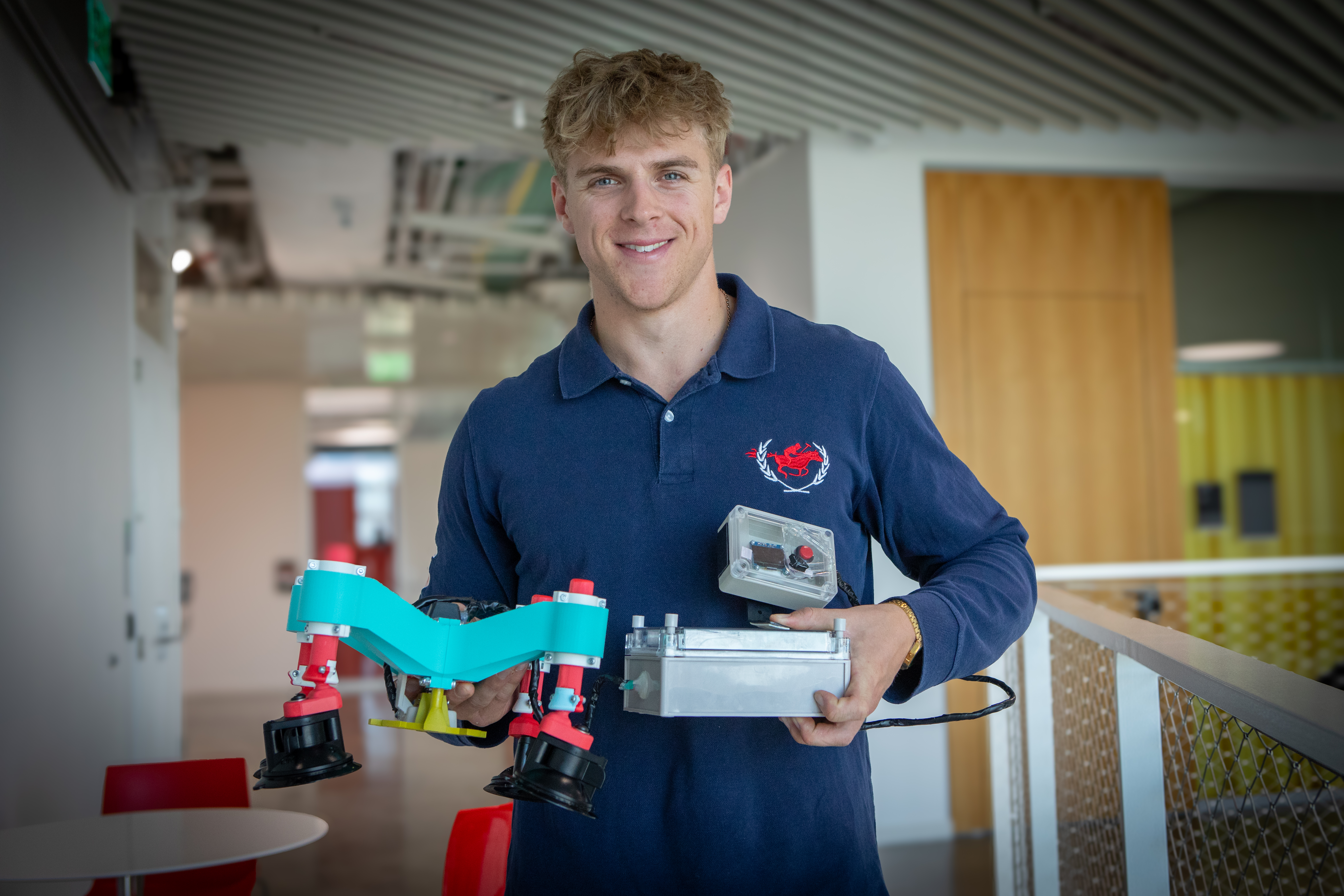 Harvard SEAS student Josh Brangan holding his senior capstone project