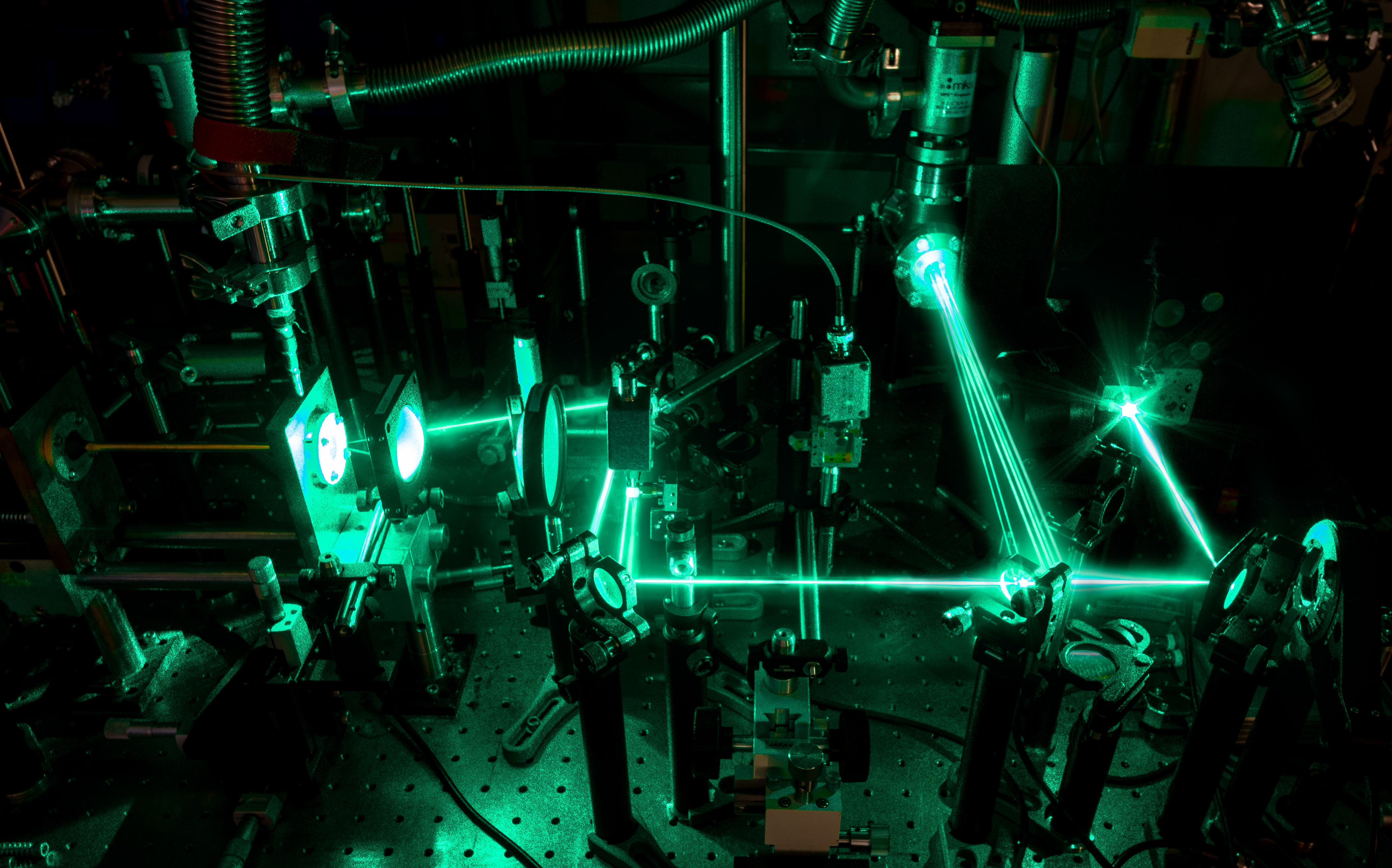 A green terahertz frequency laser