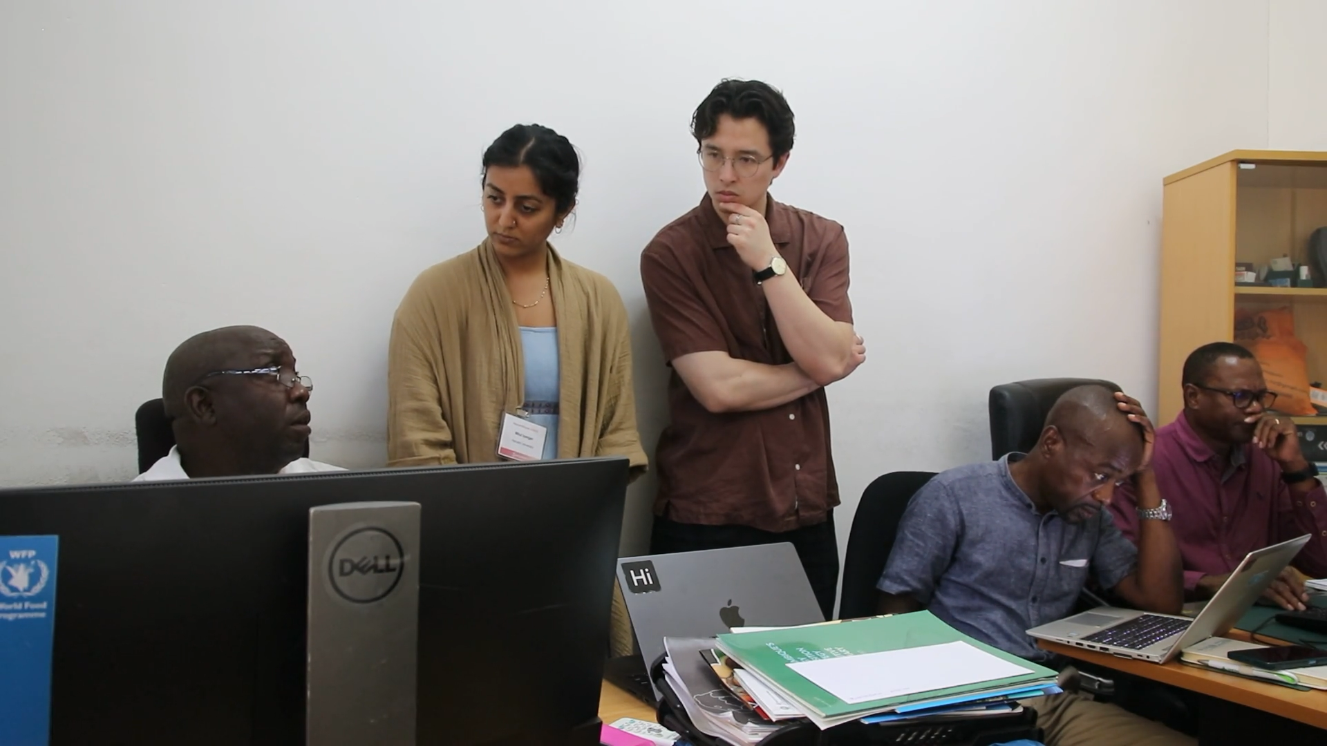 Harvard SEAS GSD alums Mitul Iyengar and Luke Fiorante chatting with meteorologists in Mozambique