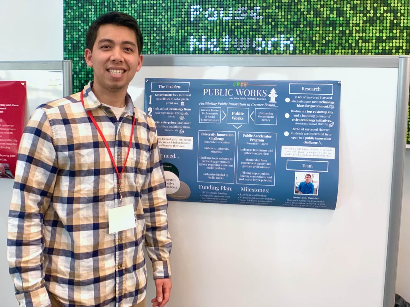 Jason Lam with a poster for the start-up "Public Works"