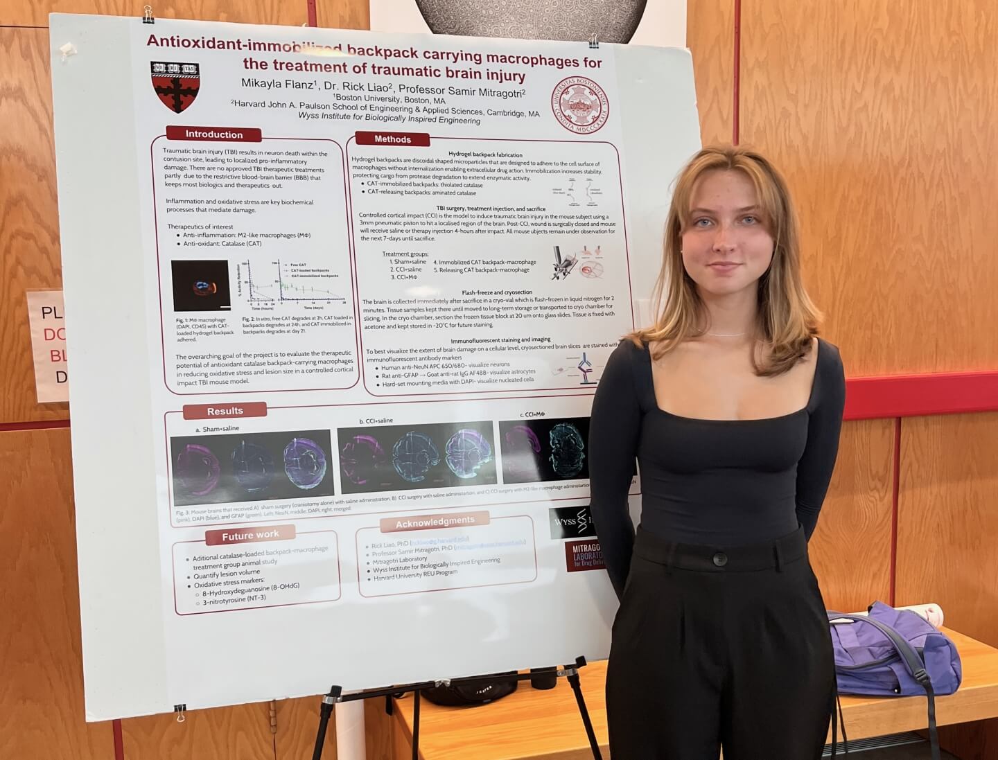 Mikayla Flanz, a rising junior studying health science at Boston University, with her REU research poster