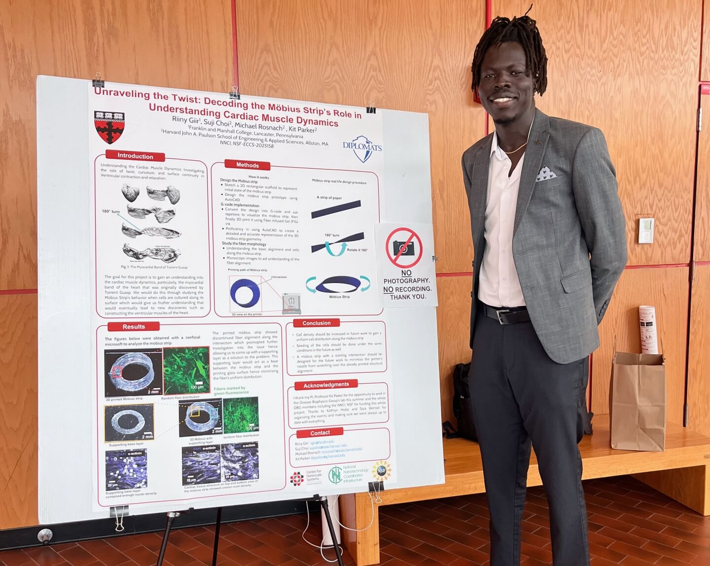Riiny Giir, a rising junior computer science major at Franklin & Marshall College, with his REU research poster