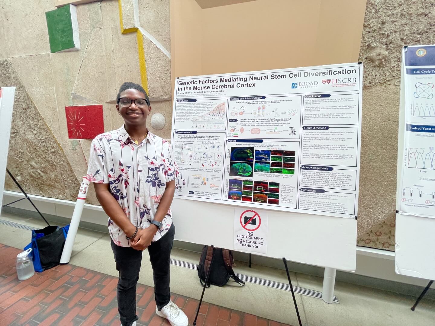 Jeremy Callaway, a rising senior majoring in neuroscience at Pomona College, with his REU research poster
