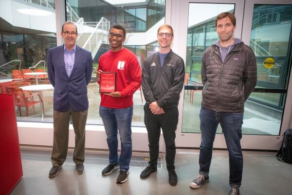 Dean Doyle, Randall St. Louis holding a plaque, Clarke Teeple and Rob Wood