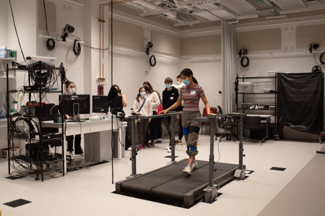 High school student walks on treadmill