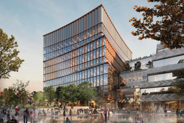 Mock up of the east side of the ERC. People and trees surround a tall building of mostly window exteriors. 
