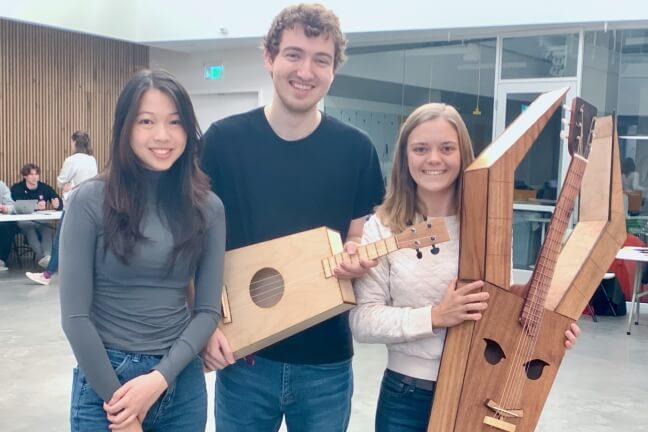 Kyra Mo, Patrick Thornton and Lillian Petersen with their baritone ukulele and lyre guitar