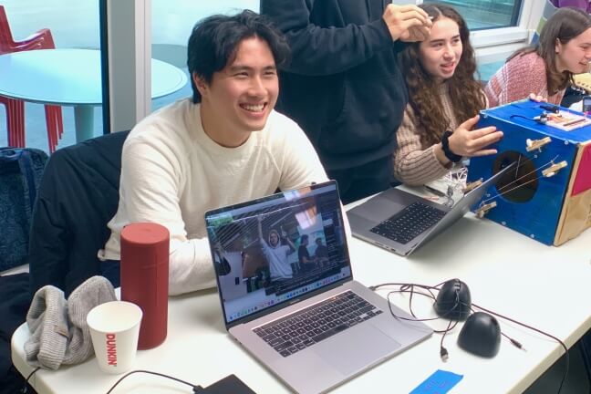 Jerry Yang watches as Nick West uses the Ambient Hand