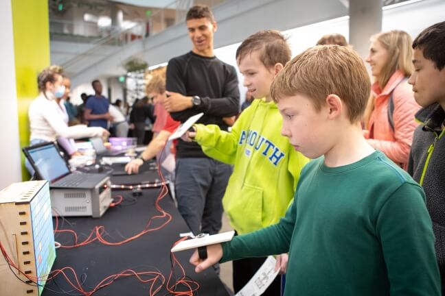Children move their virtual bird through an obstacle course at the SEAS Design and Project Fair