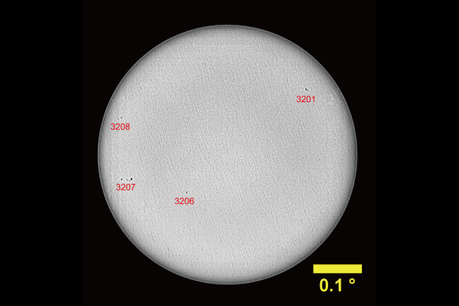 black and white image of the Sun with sunspots marked 
