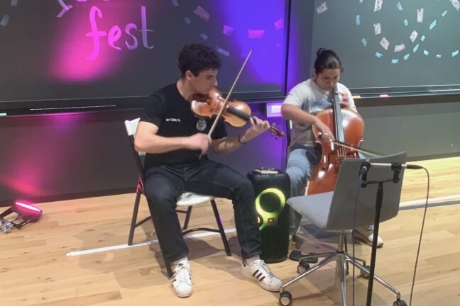 Two Harvard students playing a violin and a cello