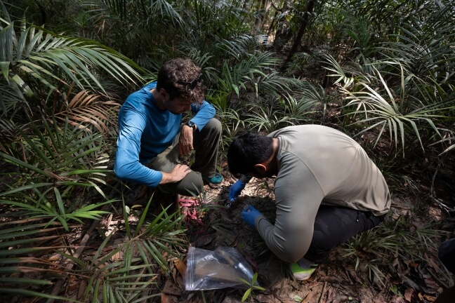 Evan Routhier (left) and Faiz Haque during sediment collection