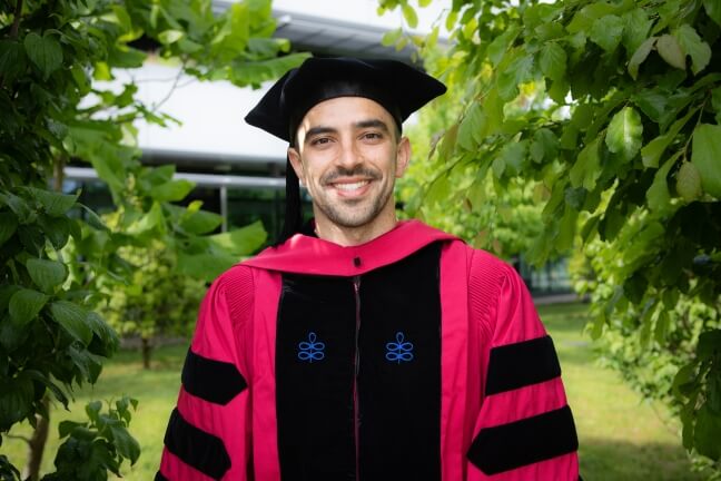 Harvard SEAS student Jonathan Alvarez wearing his crimson regalia