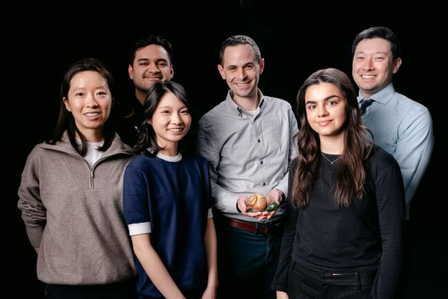 A group of male and female Harvard students and alumni