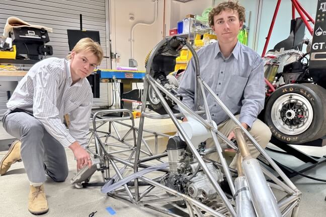 Harvard SEAS students Peter Fischer and Josh Gordon attaching an automotive drivetrain to a racecar chassis