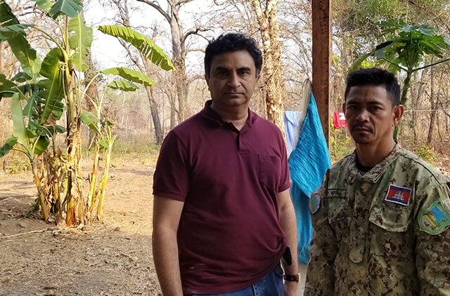 Milind Tambe with a ranger in Cambodia