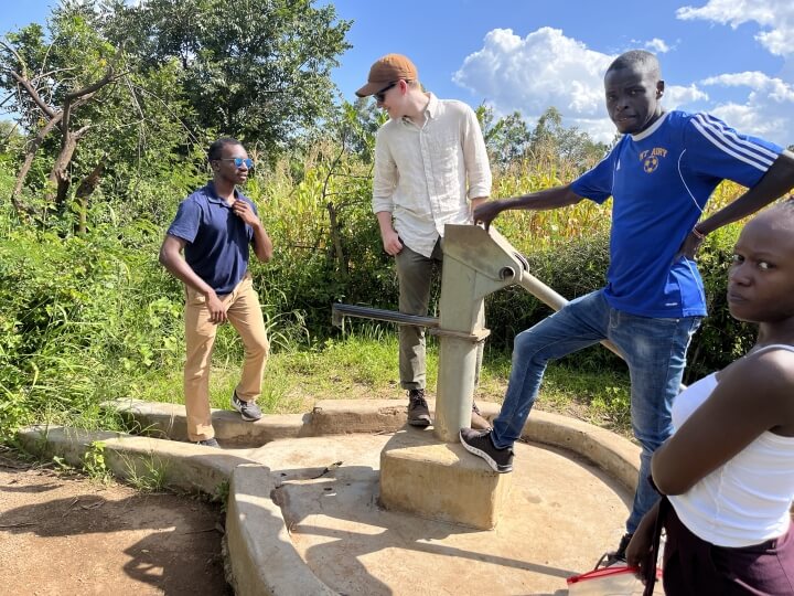 Alex Dyer inspects a well in Kenya