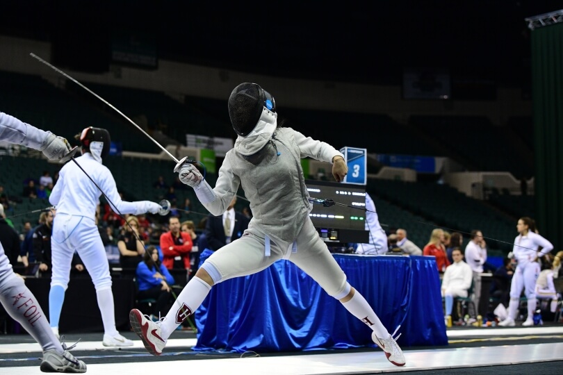 Cynthia Liu competing in a fencing competition