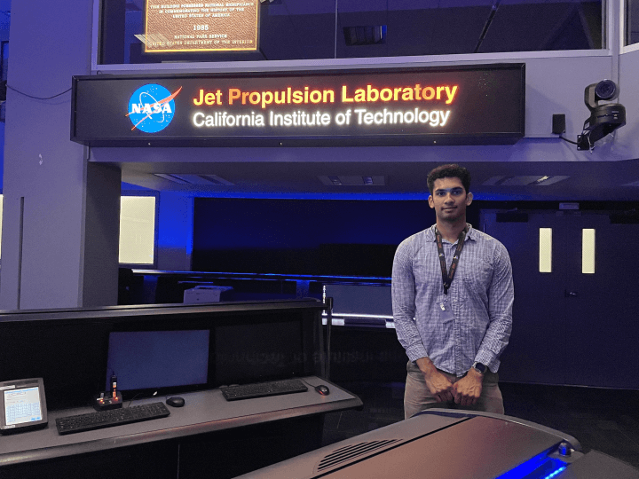 Rohil Dhaliwal, A.B. '25, standing inside the Jet Propulsion Laboratory in Pasadena