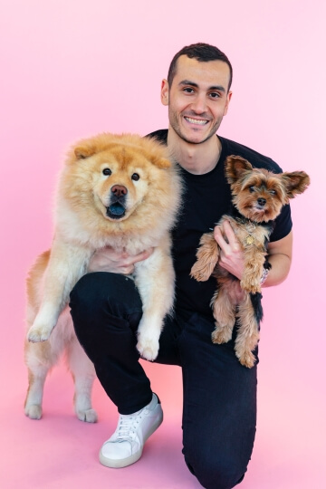 Harvard SEAS alum Marc Atiyeh, A.B. '14, with two dogs