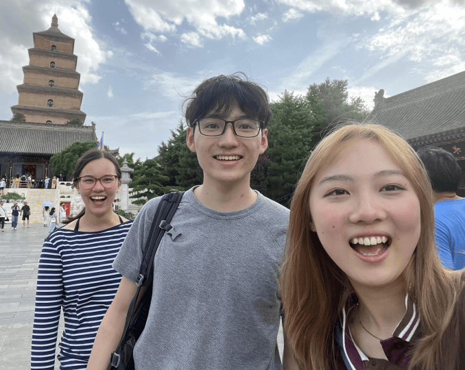 Harvard SEAS students Emily Xing, Sophie-An Kingsbury Lee and Ethan Kiang in a courtyard in Beijing