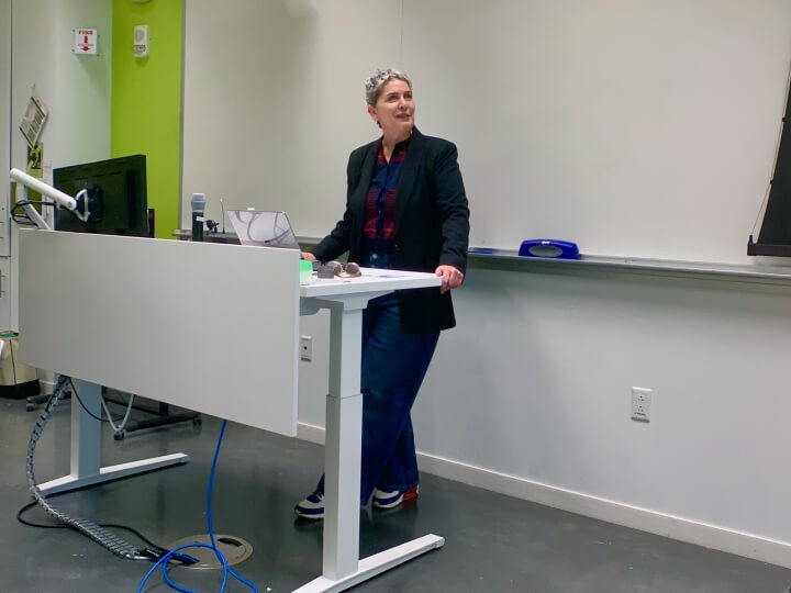 Harvard SEAS GSD professor Karen Korellis Reuther speaking at a white desk