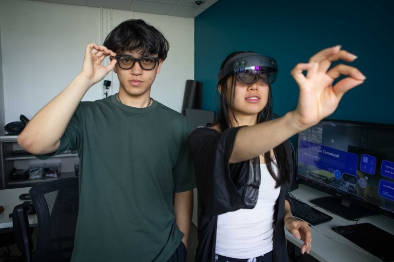 Harvard SEAS students AnhPhu Nguyen and Alice Cai wearing smart glasses and an augmented reality headset