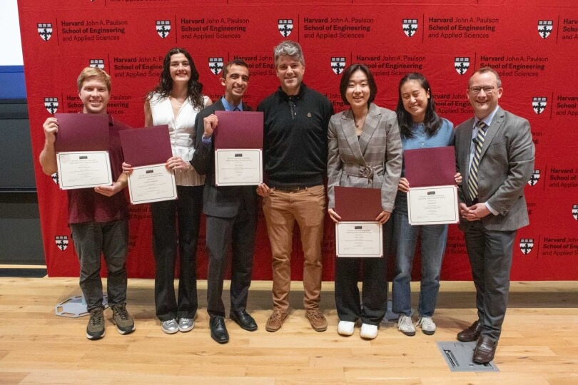 Five Harvard SEAS seniors with dean David Parkes