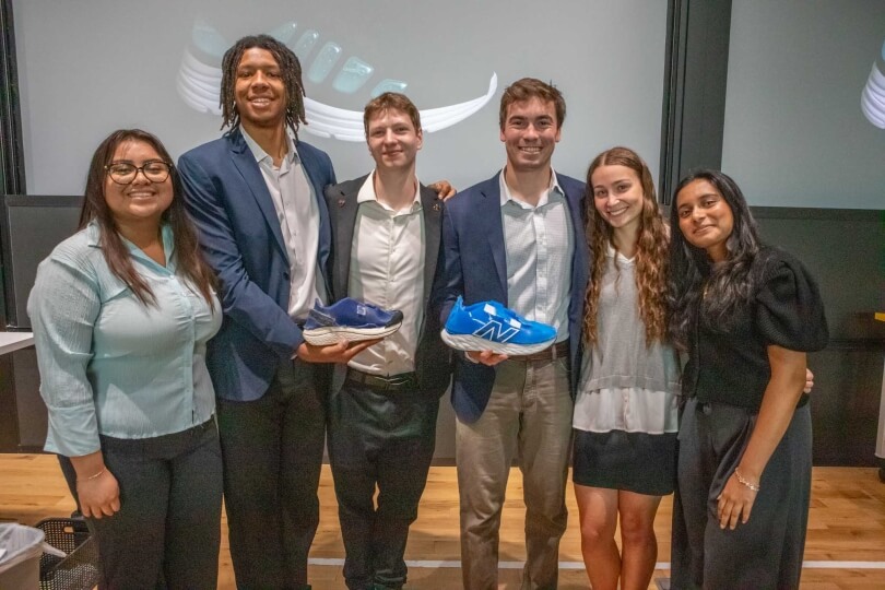 Harvard SEAS students Miranda Morales, Ayande Joseph, Thomas King, Jack Anderson, Mikaya Parente and Davina Komaravalli holding shoes