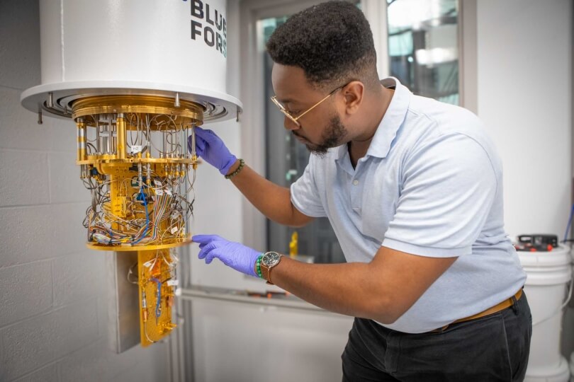 Harvard SEAS student Gregory Cunningham working with a quantum computing dilution refrigerator