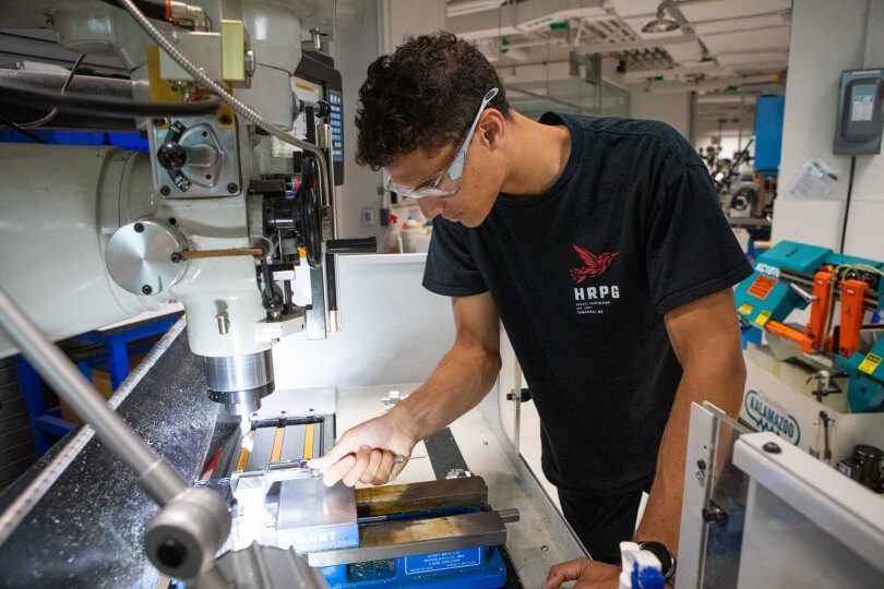 Harvard SEAS student Nathan Evans working at a lathe