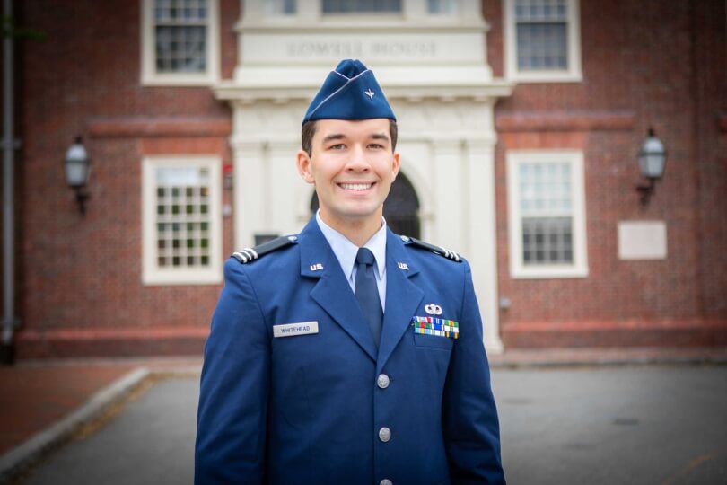 Harvard SEAS student Charles "Trey Whitehead," wearing his Air Force ROTC uniform, in front of the entrance to Lowell House