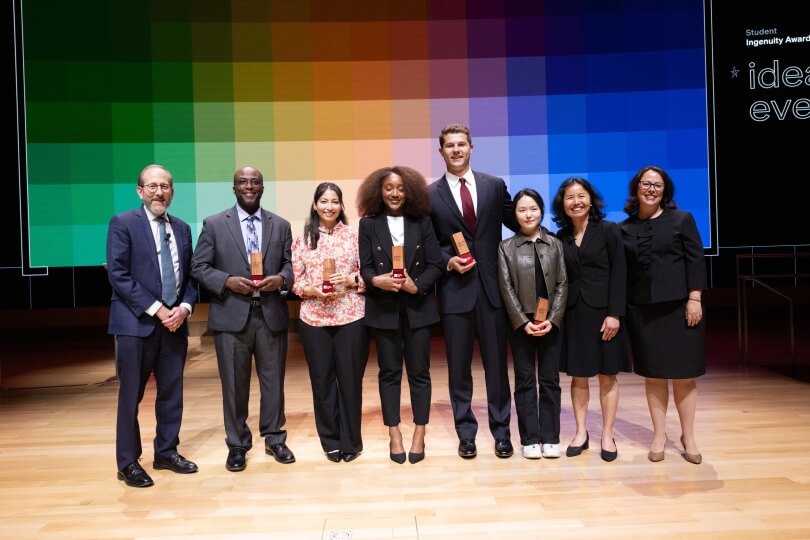 Five Harvard students with president Alan M. Garber and Innovation Labs staff