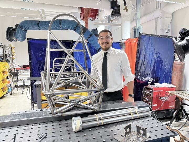 Harvard SEAS student Edwin Dominguez with his FSAE racecar chassis