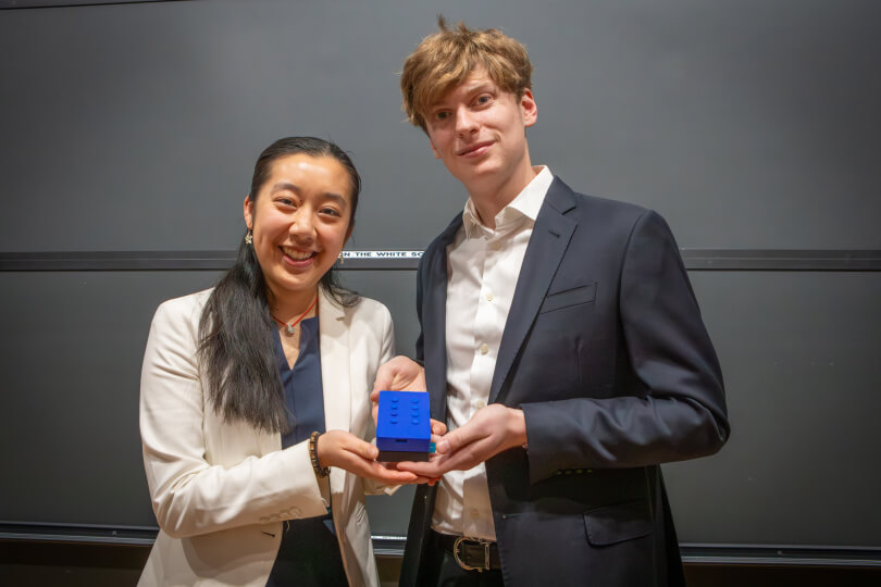 Harvard SEAS students Anya Zhang and Nathaniel Marinaccio holding a blue counting device