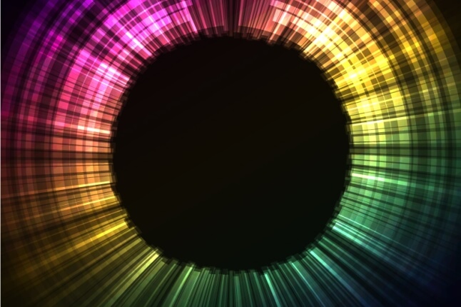 image of a rainbow of light around a dark circle