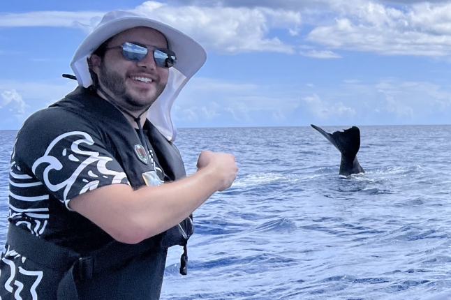 Michael Bell, Ph.D. '21, with a whale