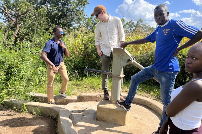 Alex Dyer inspects a well in Kenya