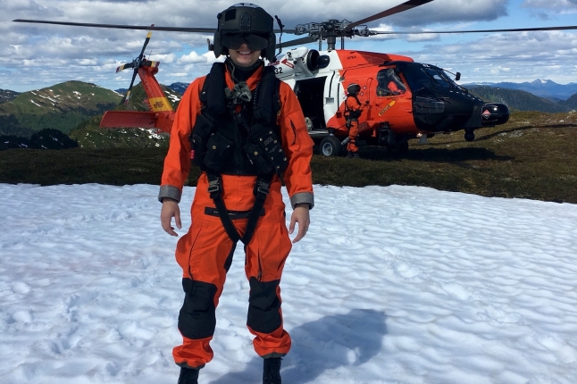 Andrew Lund in front of a helicopter