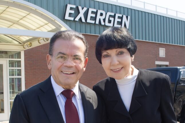 Francesco and Marybeth Pompei standing in front of Exergen, their medical device company