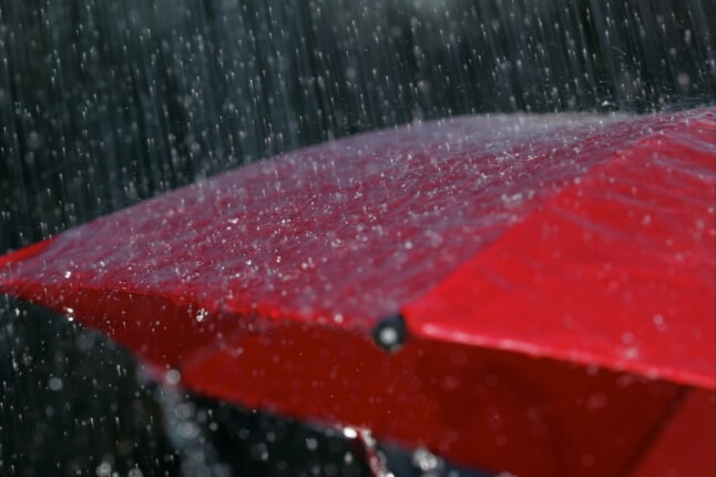 red umbrella in rain