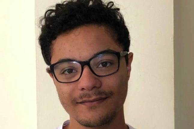 essay on artificial intelligence taking over human intelligence Harvard SEAS Ph.D. student Lucas Monteiro Paes wearing a white shirt and black glasses