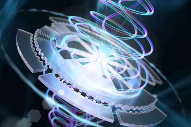 Abstract image depicting a luminous, mechanical structure with intricate, glowing coils and circuitry. The coils emit vibrant light in shades of blue, purple, and cyan, forming spiral patterns. The background is a dark, blurred network of interconnected lines and nodes.