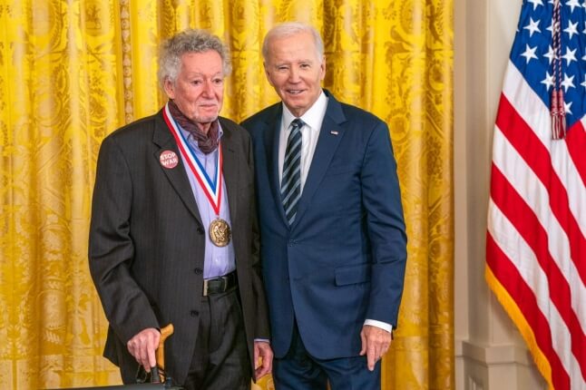 Sheldon Weinbaum, S.M. '60, Ph.D. '63 and U.S. President Joe Biden next to an American flag