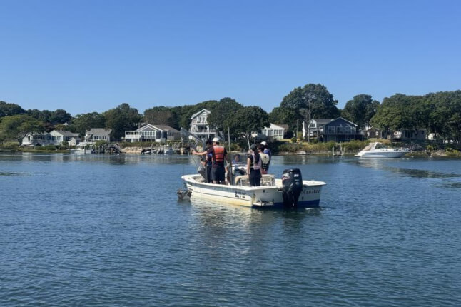 student on a research boat