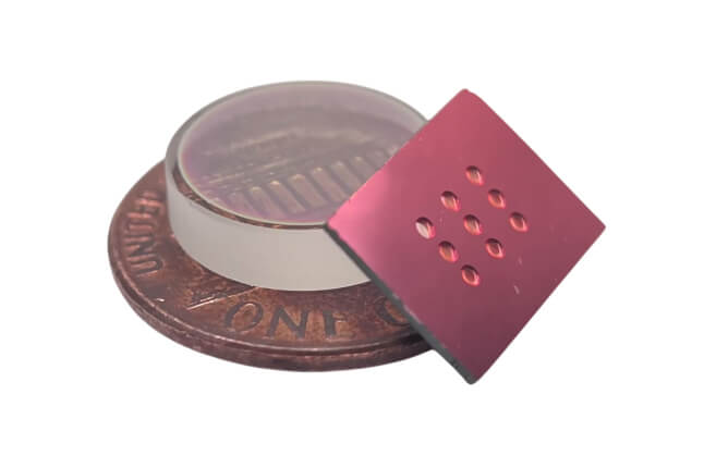 A fabricated micromirror array, a micromirror next to a penny, and a half-inch diameter commercial mirror