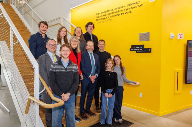 President Alan Garber (center) and Dean David Parkes (far left) with members of the Troper Wojcicki family
