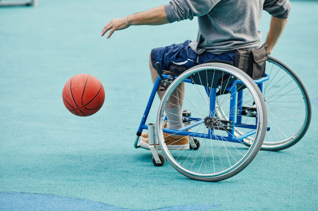person playing wheelchair basketball