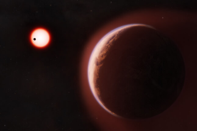 This artist conceptualization shows the exoplanet LHS 1140 b in the foreground surrounded by a helium-rich atmosphere. In the distance is its red dwarf star orbited by another rocky planet.